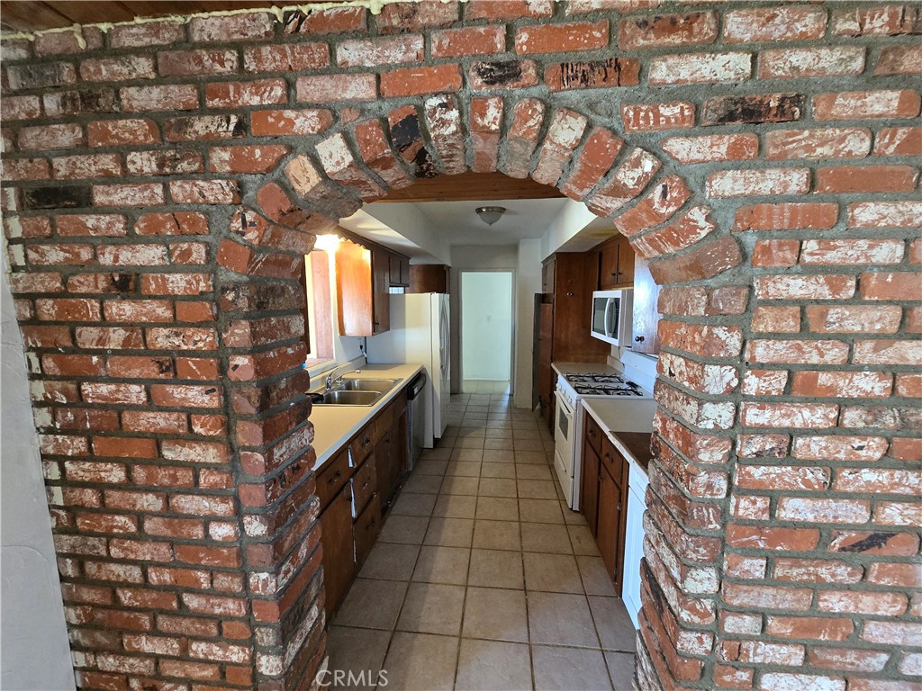 11067 Maureen Drive Cherry Valley, CA 92223 - Photo 12 of 23 a large room with a stove and cabinets