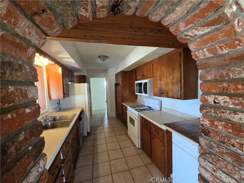 11067 Maureen Drive Cherry Valley, CA 92223 - Photo 13 of 23 a kitchen with stainless steel appliances granite countertop a sink and a stove