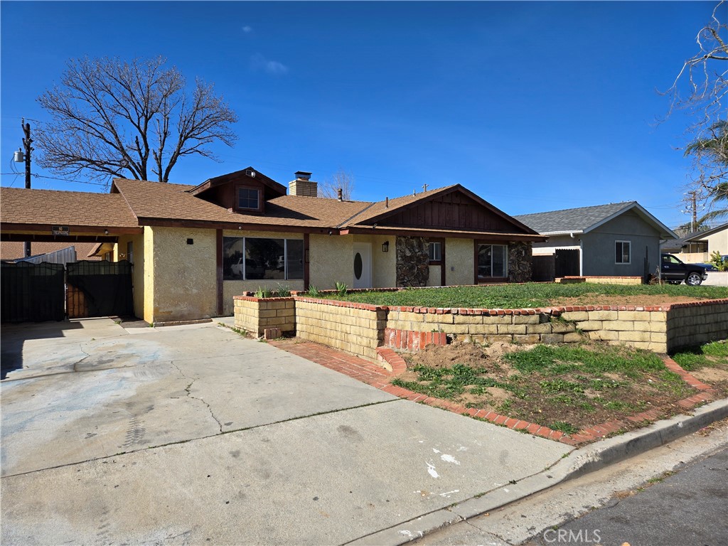 11067 Maureen Drive Cherry Valley, CA 92223 - Photo 2 of 23 a front view of a house with garden