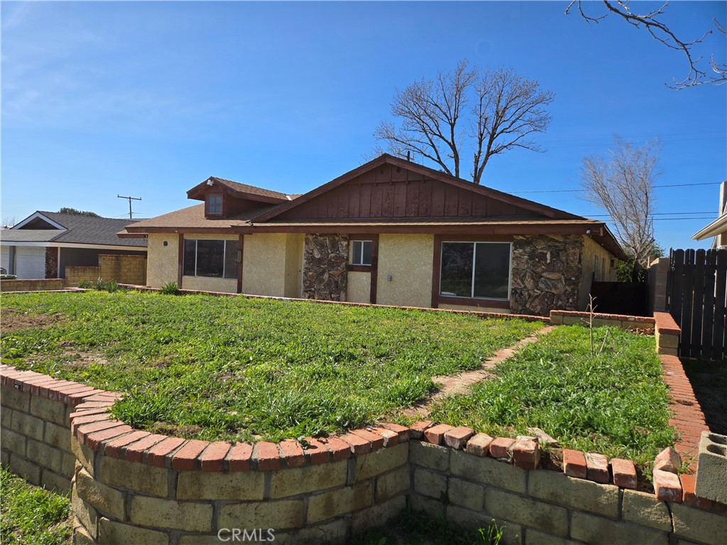 11067 Maureen Drive Cherry Valley, CA 92223 - Photo 3 of 23 a view of a house with a yard and potted plants