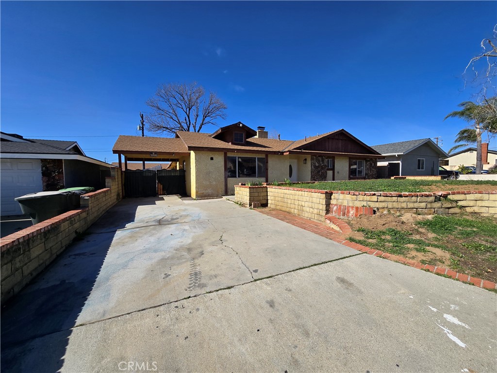 11067 Maureen Drive Cherry Valley, CA 92223 - Photo 4 of 23 a view of a house with a yard