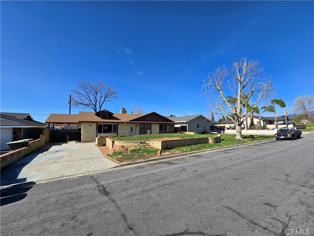 11067 Maureen Drive Cherry Valley, CA 92223 - Photo 6 of 23 a view of a house with a yard and sitting area