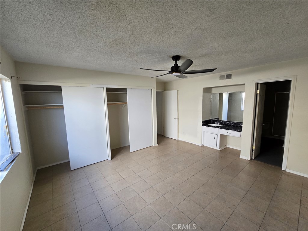 11067 Maureen Drive Cherry Valley, CA 92223 - Photo 9 of 23 a view of a refrigerator in kitchen and natural light