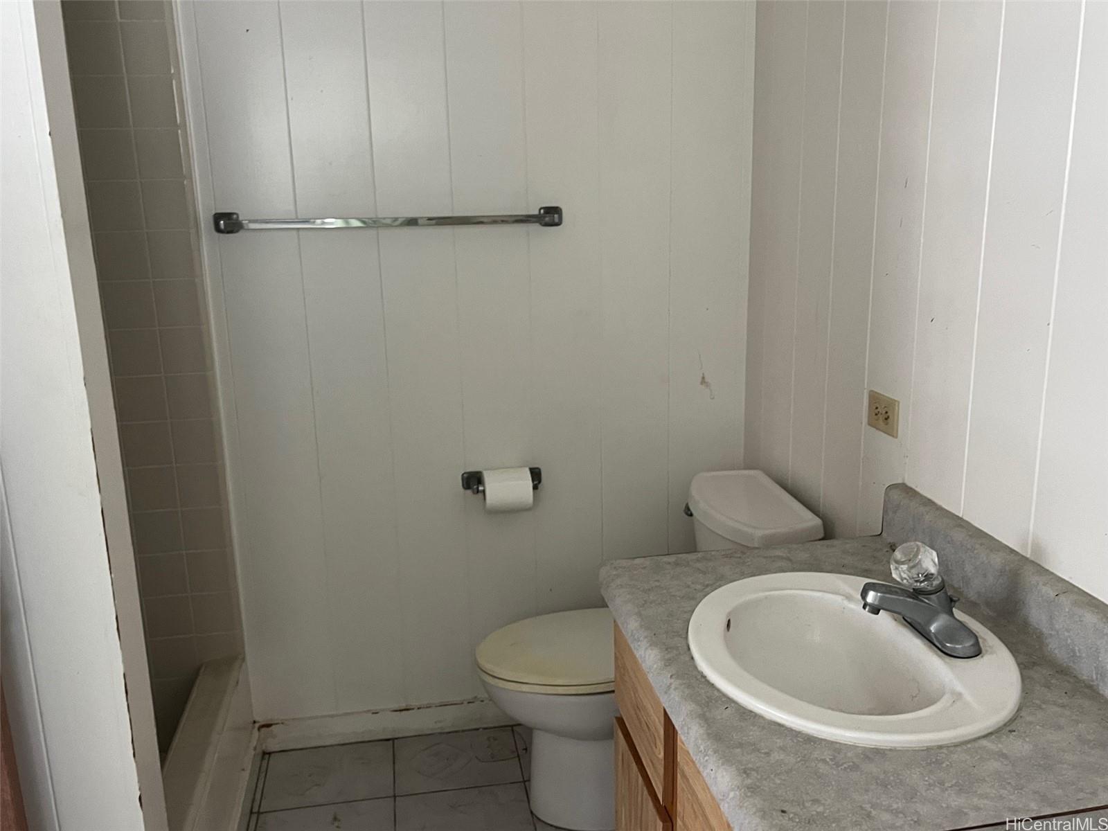 2153 Booth Road Honolulu, HI 96813 - Photo 12 of 18 a bathroom with a sink and a toilet