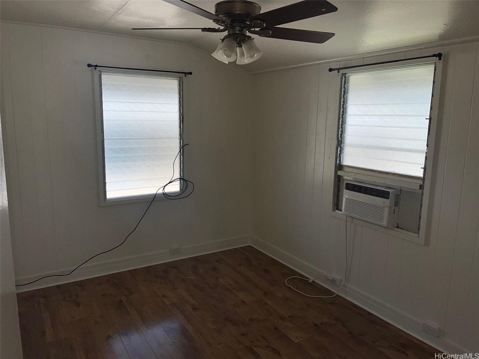 2153 Booth Road Honolulu, HI 96813 - Photo 8 of 18 an empty room with wooden floor closet and windows