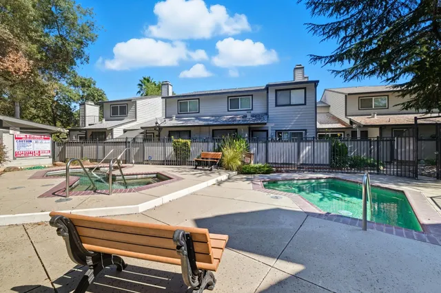 a view of a backyard with sitting area
