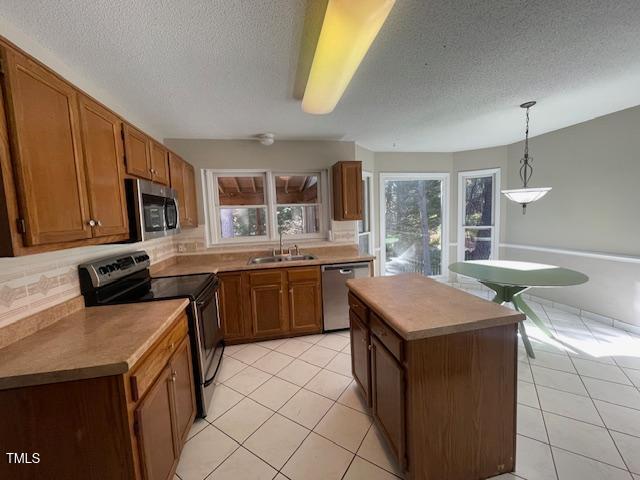 107 Glen Alpine Circle Cary, NC 27513 - Photo 8 of 17 a kitchen with a sink a stove a microwave a counter top space and cabinets