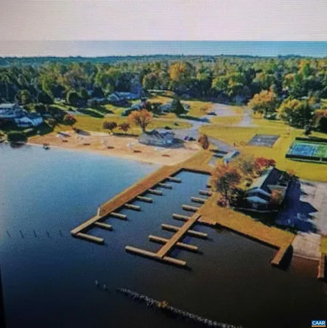 a view of a swimming pool with a table and chairs