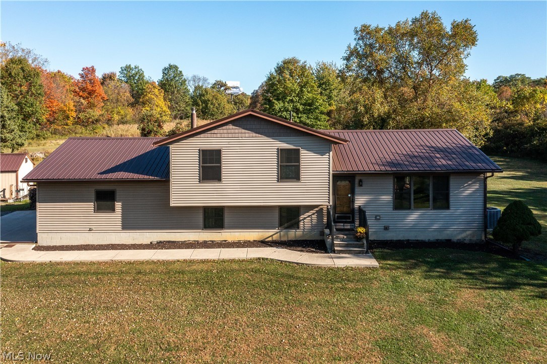 6760 Mason Road Berlin Heights, OH 44814 - Photo 38 of 49 View of front facade featuring a metal roof and a front lawn