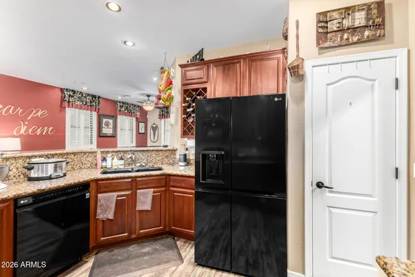 a kitchen with stainless steel appliances a refrigerator and a stove