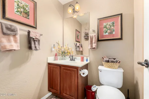 a bedroom with a bed and a dresser in it