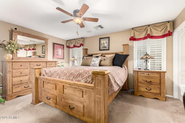 a bed room with a bed and a gym equipment