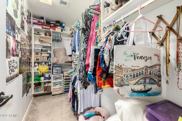 a bedroom with a bed and a cabinets