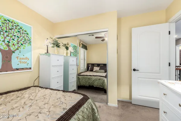 a bedroom with furniture and a window
