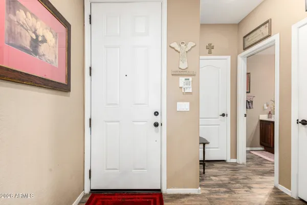 wooden floor with white walls