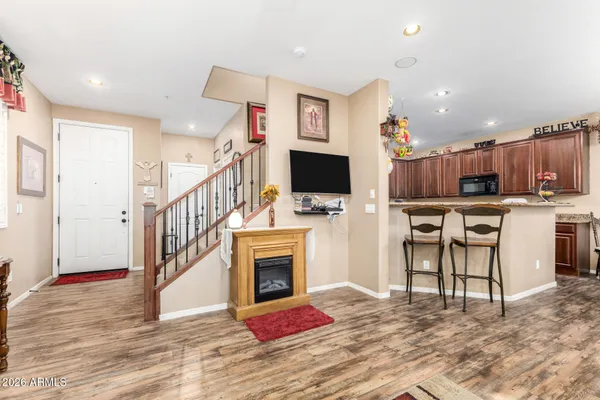 a view of kitchen with microwave stove and cabinets