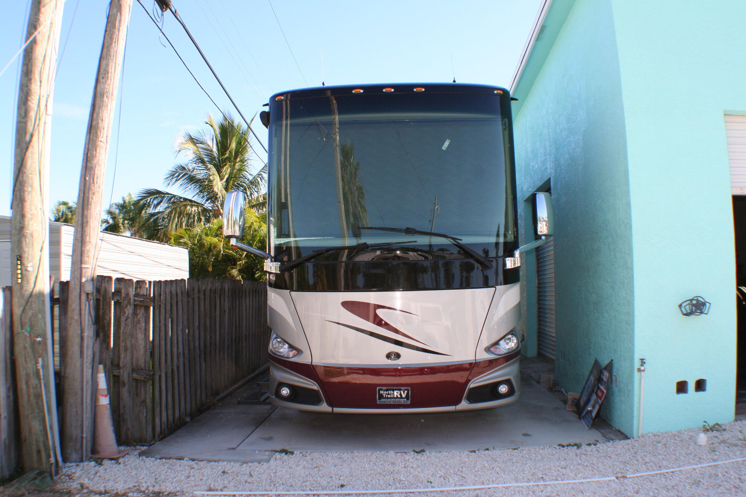 142 Eldorado Street Fort Pierce, FL 34949 - Photo 3 of 5 a car parked in front of a door