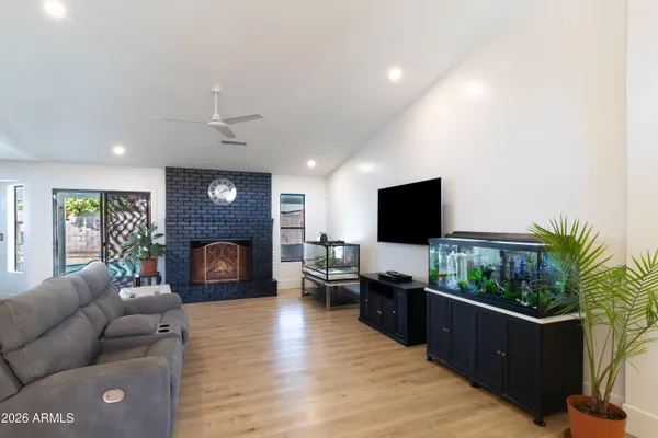 a living room with furniture and a flat screen tv