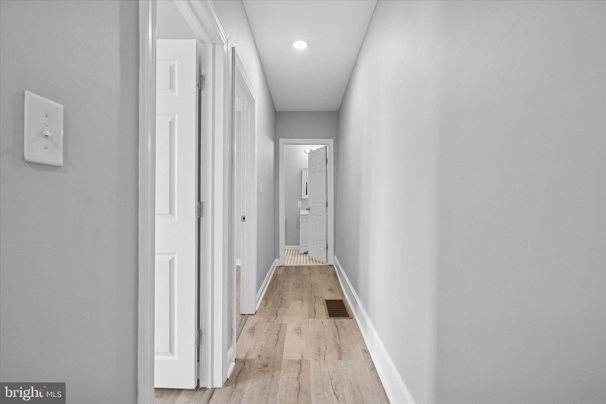 5861 Cedar Avenue Philadelphia, PA 19143 - Photo 13 of 39 a view of a hallway with wooden floor