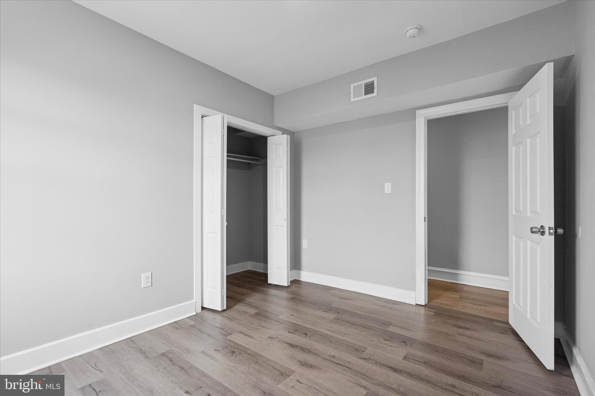 5861 Cedar Avenue Philadelphia, PA 19143 - Photo 32 of 39 a view of an empty room with wooden floor