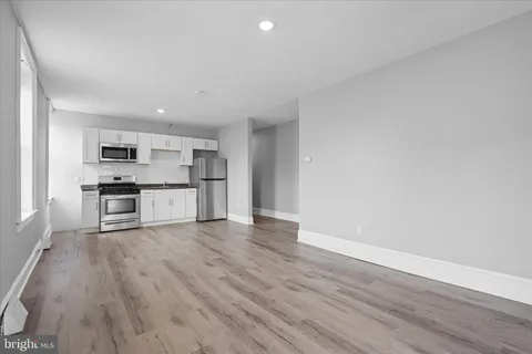 a view of kitchen with wooden floor
