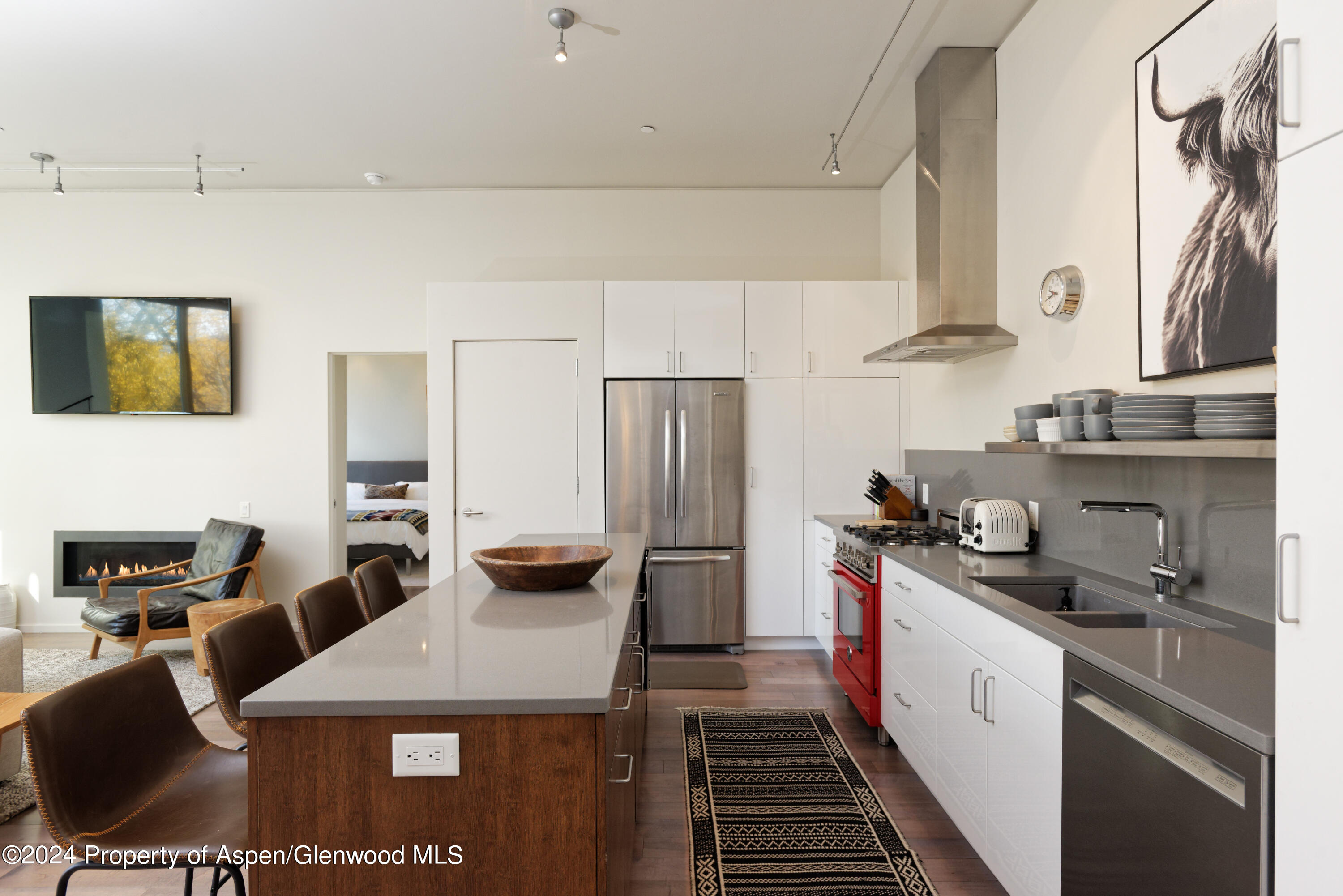 202 Evans Road, Unit 204 Basalt, CO 81621 - Photo 3 of 11 a kitchen with a refrigerator and a stove