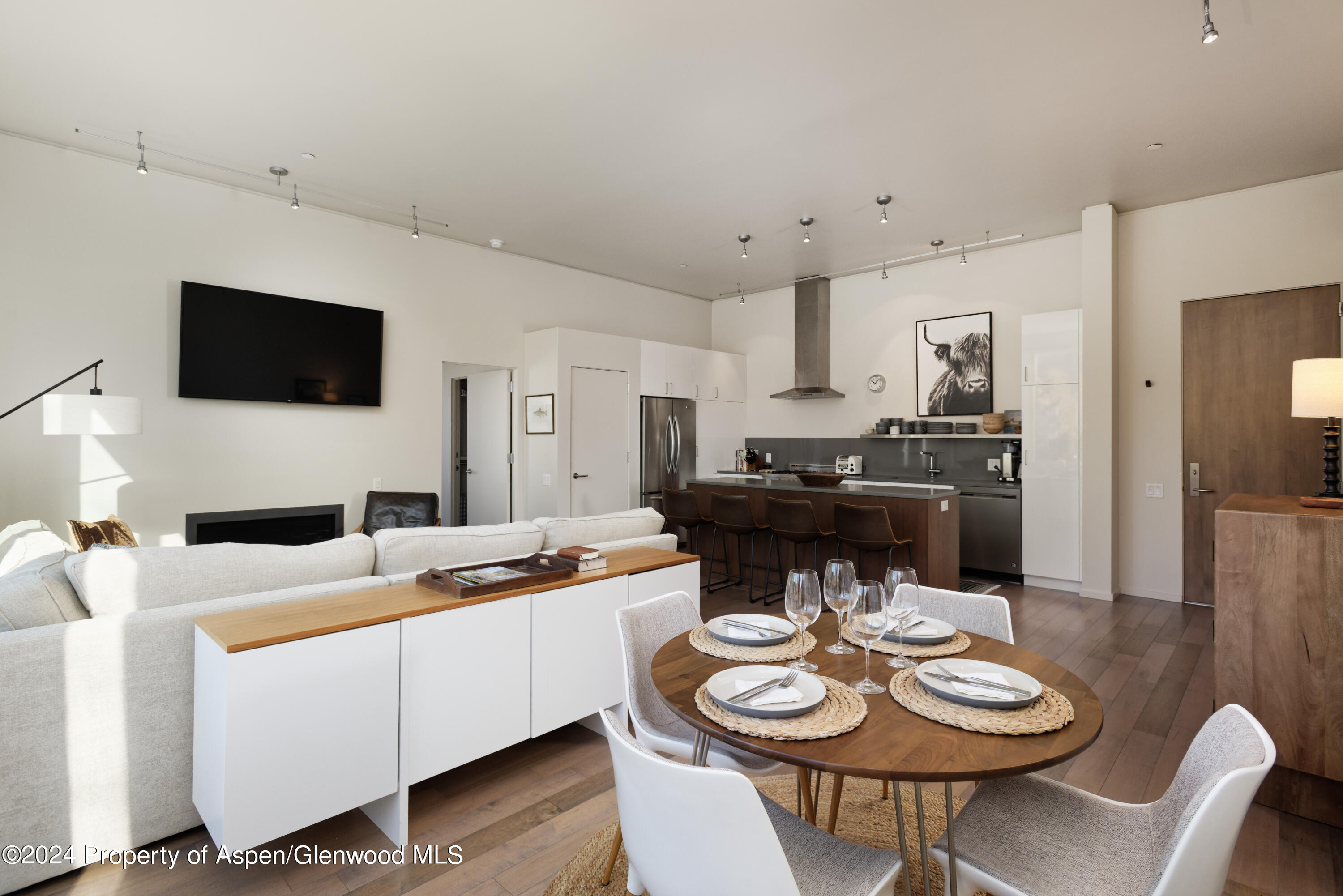 202 Evans Road, Unit 204 Basalt, CO 81621 - Photo 5 of 11 a kitchen with a dining table and chairs