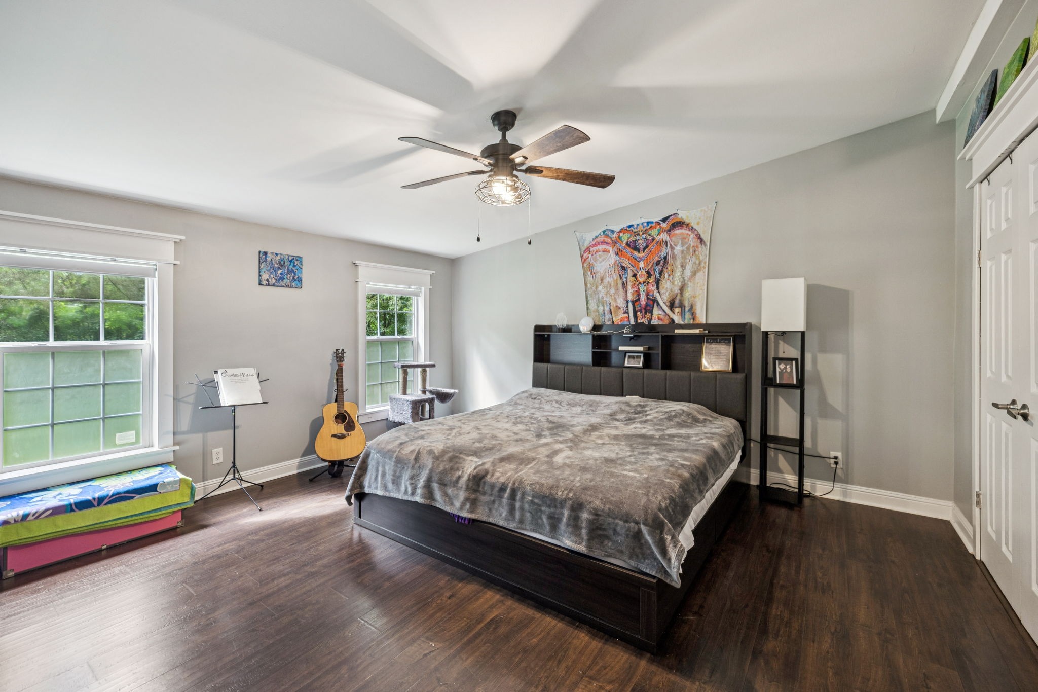 3063 Sweethome Road Chapmansboro, TN 37035 - Photo 18 of 46 a bedroom with a bed and a chandelier