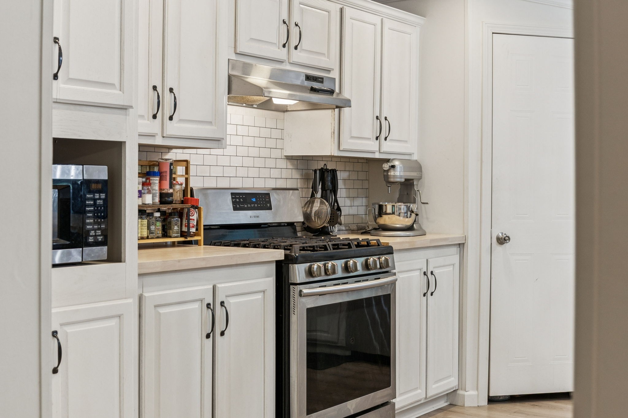 3063 Sweethome Road Chapmansboro, TN 37035 - Photo 8 of 46 a kitchen with stainless steel appliances granite countertop white cabinets and a stove