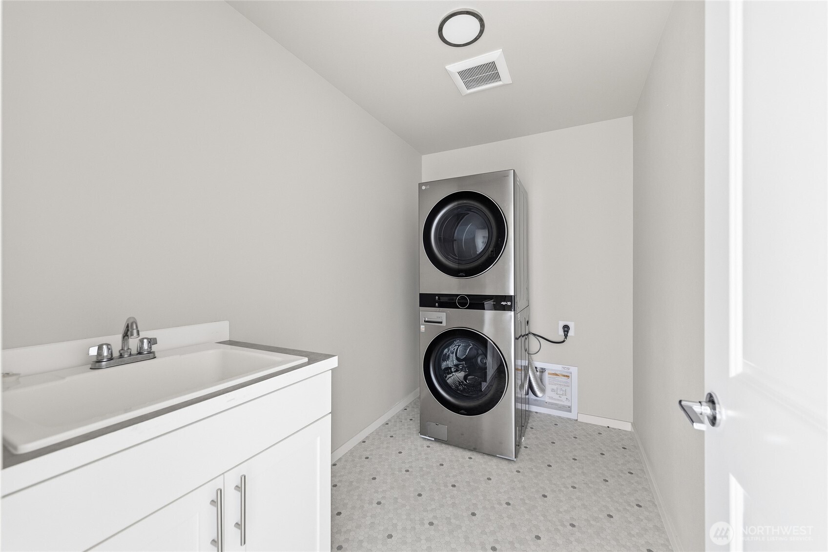 1066 Southwest 99th Place, Unit 55 Seattle, WA 98106 - Photo 13 of 21 a bathroom with a sink and a washing machine