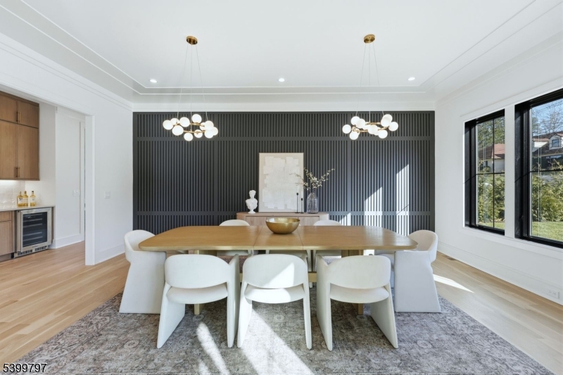 15 Sparta Road Short Hills, NJ 07078 - Photo 4 of 16 a view of a dining room with furniture and chandelier