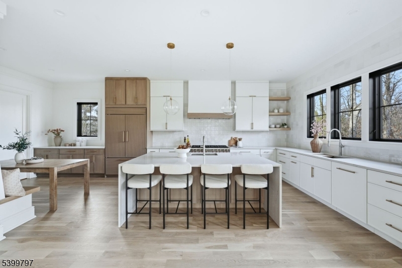 15 Sparta Road Short Hills, NJ 07078 - Photo 5 of 16 a large kitchen with a table and chairs