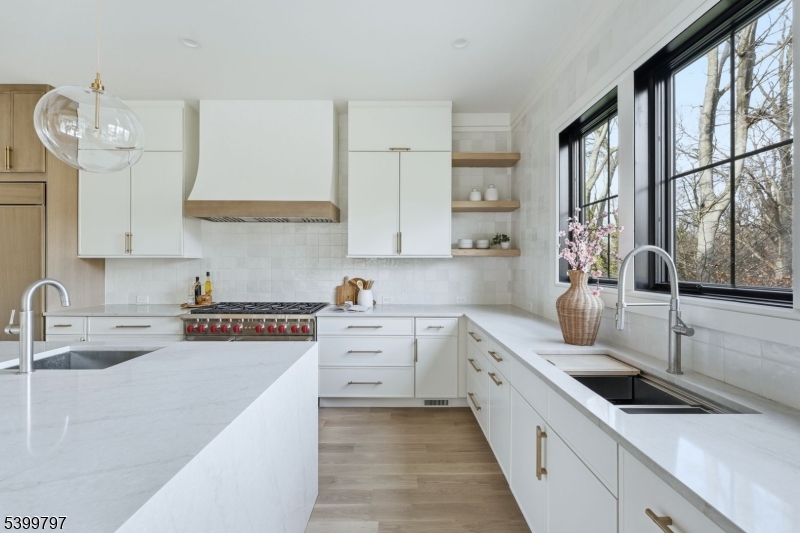 15 Sparta Road Short Hills, NJ 07078 - Photo 7 of 16 a kitchen with white cabinets and sink