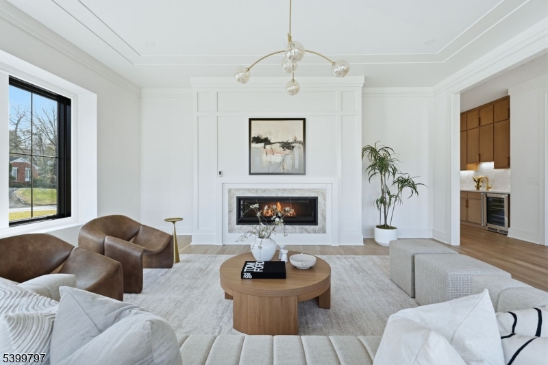 15 Sparta Road Short Hills, NJ 07078 - Photo 9 of 16 a living room with furniture and a fireplace
