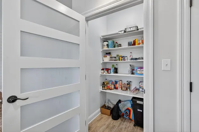 a view of a closet with storage