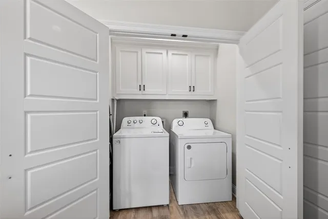 a view of storage and utility room with washer and dryer