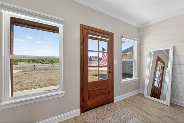a view of an entryway door and a window