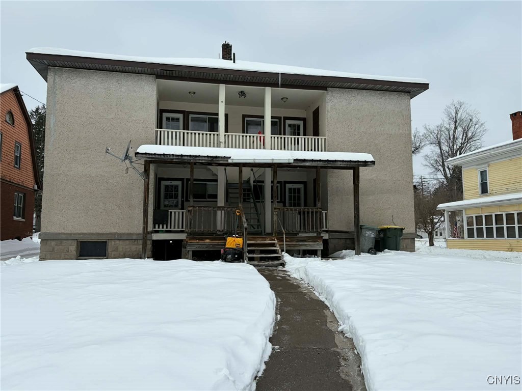 69 North Main Street Bainbridge, NY 13733 - Photo 14 of 23 view from parking area, each unit has a little por