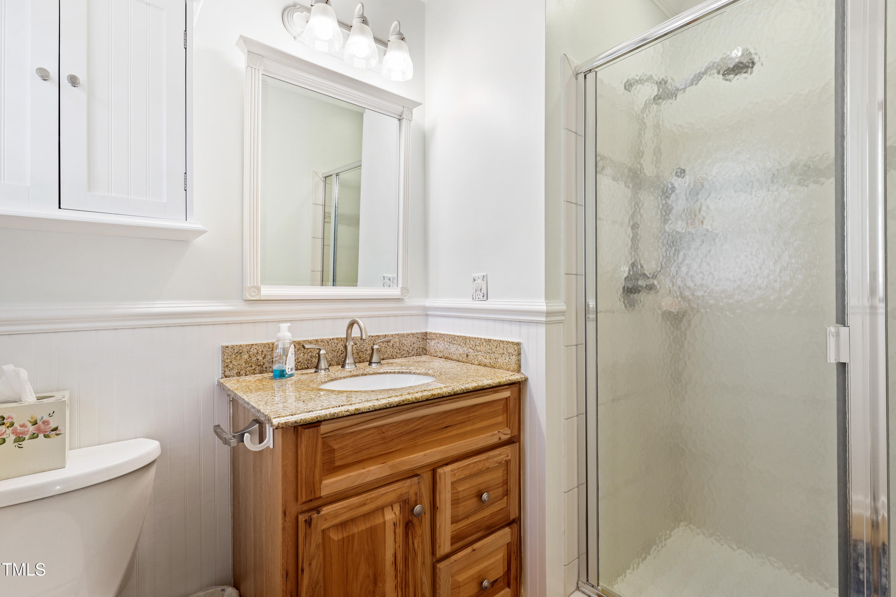2617 Cottage Circle Raleigh, NC 27613 - Photo 16 of 27 a bathroom with a sink a toilet and shower