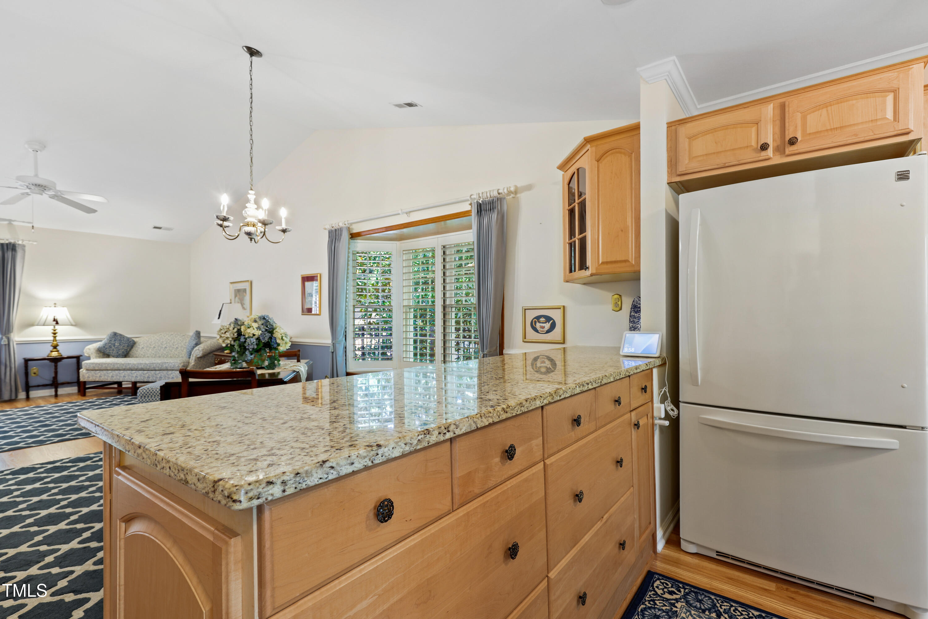 2617 Cottage Circle Raleigh, NC 27613 - Photo 10 of 27 a kitchen with kitchen island granite countertop a refrigerator a oven a sink and dishwasher with wooden floor