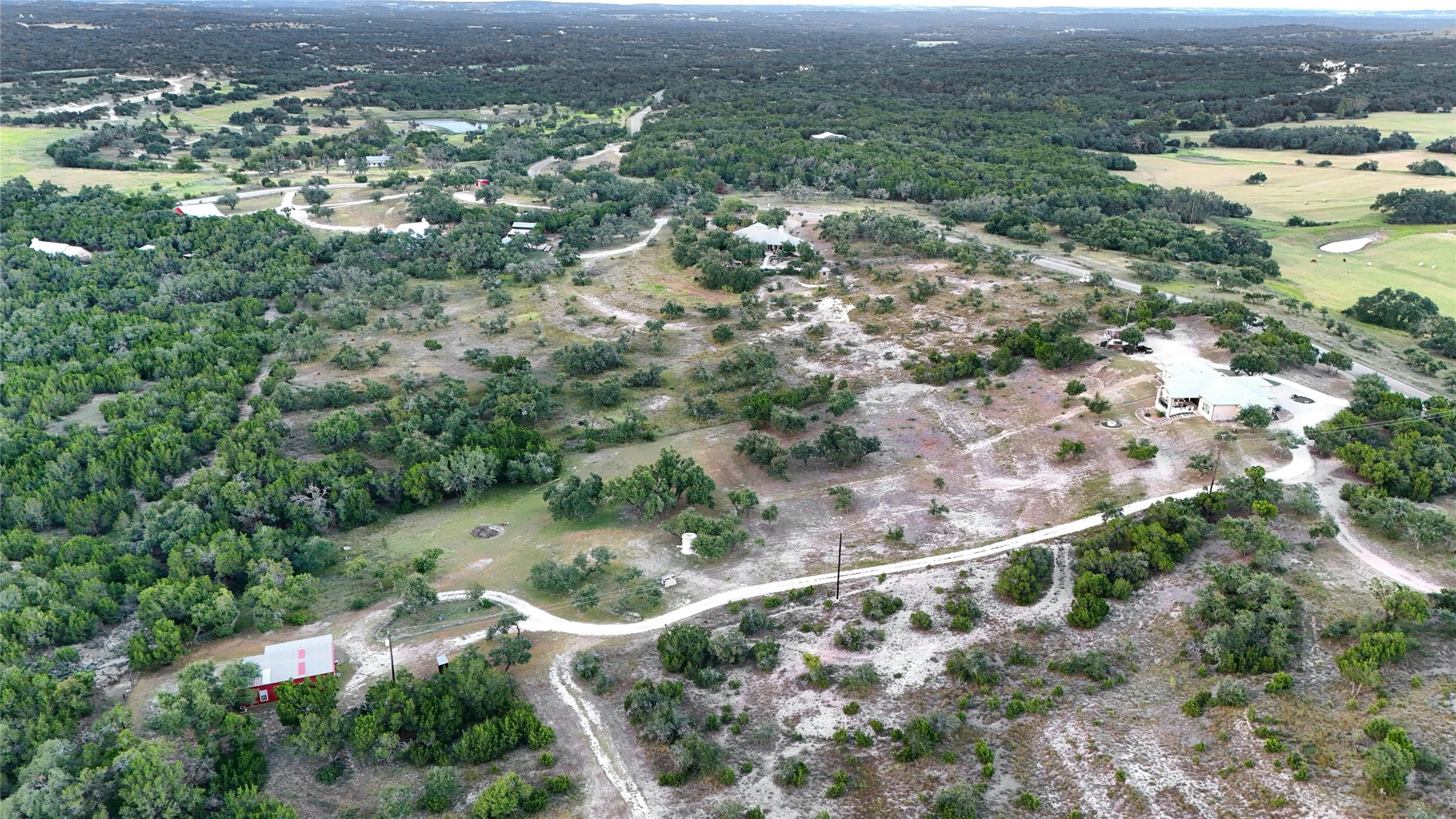 8019 Mt Sharp Road Wimberley, TX 78676 - Photo 14 of 14 an aerial view of residential houses with outdoor space and trees