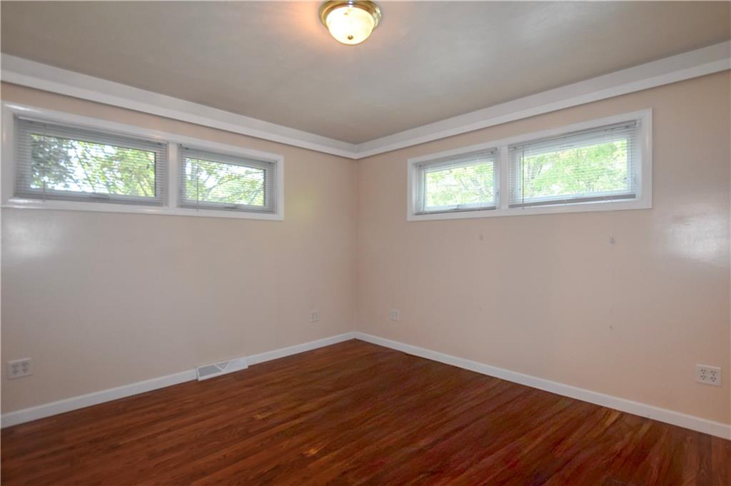 219 A Meridian Road Butler, PA 16001 - Photo 18 of 43 a view of an empty room with wooden floor and a window