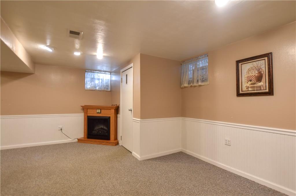 219 A Meridian Road Butler, PA 16001 - Photo 27 of 43 a view of an empty room with a fireplace
