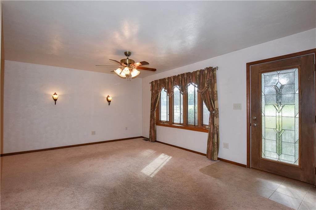 219 A Meridian Road Butler, PA 16001 - Photo 4 of 43 an empty room with chandelier fan and windows
