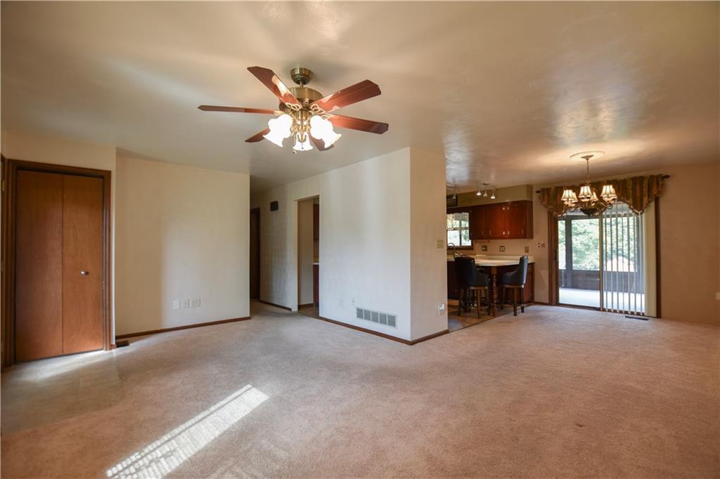 219 A Meridian Road Butler, PA 16001 - Photo 6 of 43 a view of a livingroom with a projector & furniture