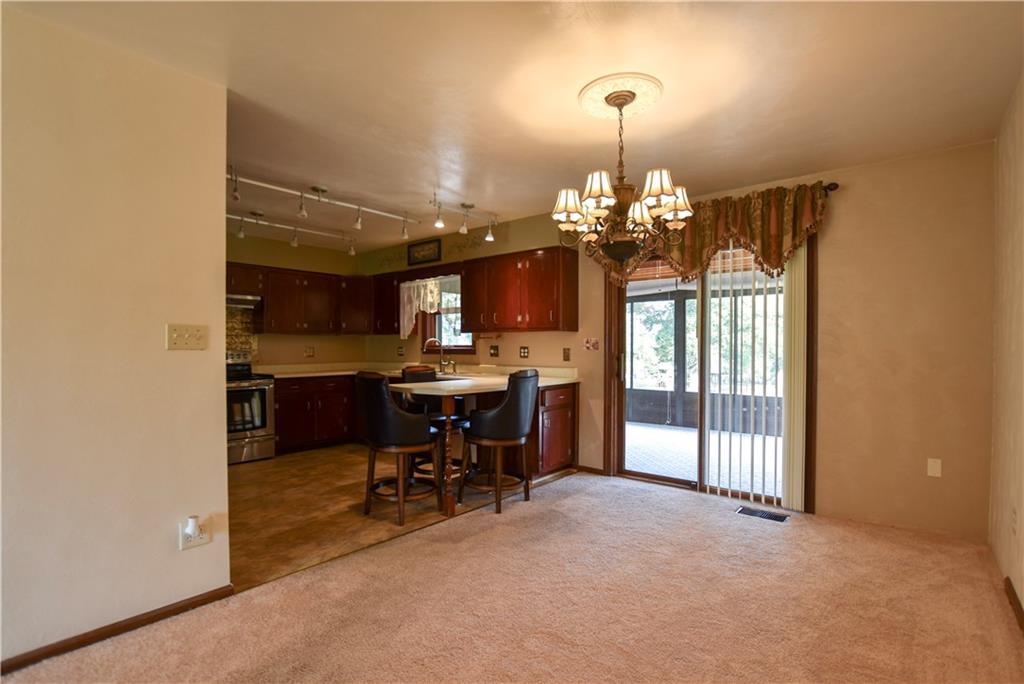 219 A Meridian Road Butler, PA 16001 - Photo 7 of 43 a view of a dining room with furniture and chandelier