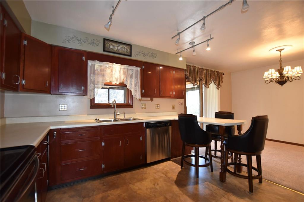 219 A Meridian Road Butler, PA 16001 - Photo 10 of 43 a kitchen with granite countertop a sink cabinets and window