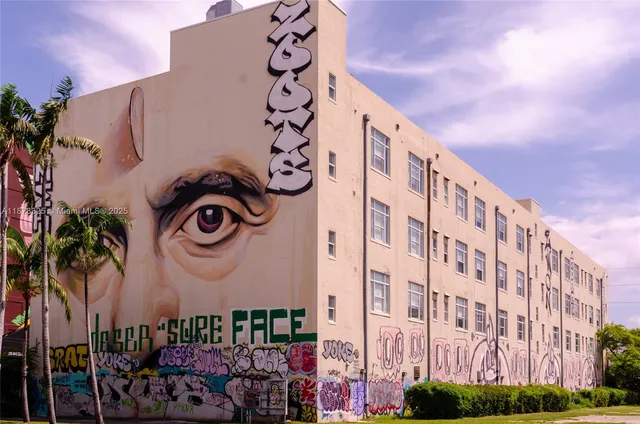 a front view of a building with entryway and a street