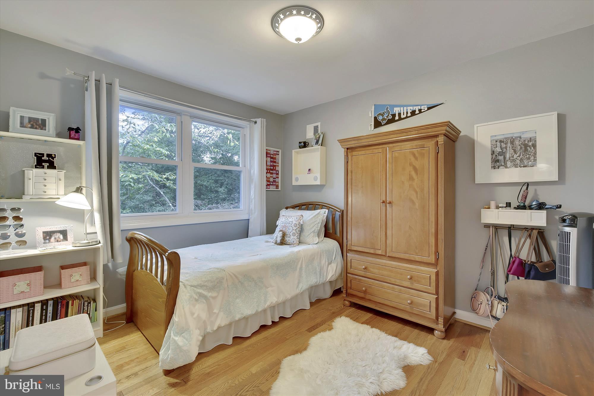 9121 Seven Locks Road Bethesda, MD 20817 - Photo 14 of 30 a bedroom with a bed next to a window