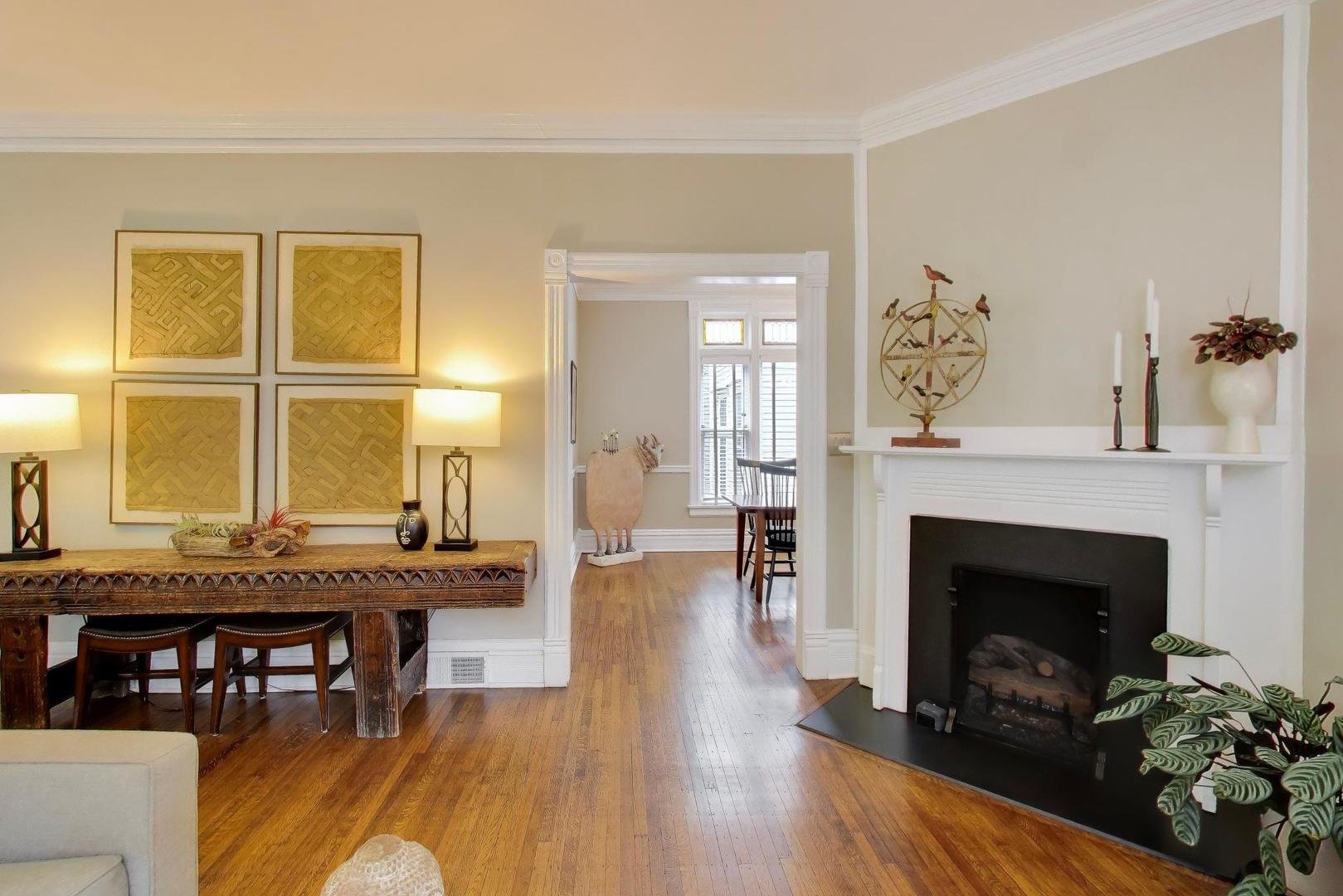 1235 Maple Avenue Evanston, IL 60202 - Photo 13 of 57 a living room with granite countertop wooden floor table and a fireplace